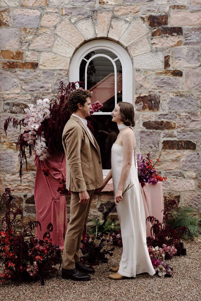 wedding vows being spoken between hisband and wife at miss midgleys apartments